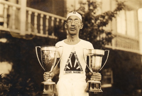 Man holding trophies (ddr-njpa-4-2328)