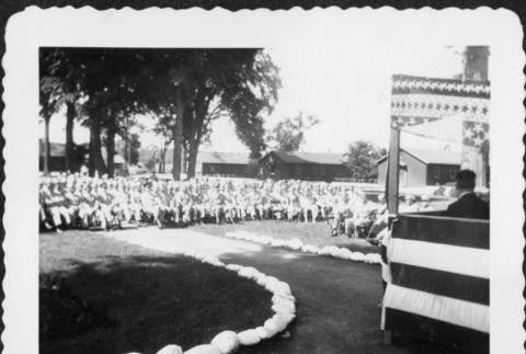 Crowd of people seated facing stage (ddr-densho-434-392)