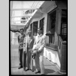 Three men on a ship deck (ddr-densho-475-129)