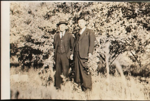 Two men in an apple orchard (ddr-densho-259-257)