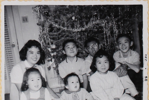 Shiomi siblings with other children by Christmas tree (ddr-densho-522-566)
