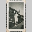 Adolescent girl standing near car (ddr-densho-321-146)