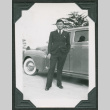 Man in a suit in front of car (ddr-densho-475-613)