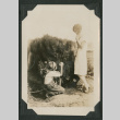 young boy kneeling before a woman (ddr-densho-378-494)