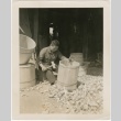 A man working on a wooden barrel (ddr-densho-299-6)