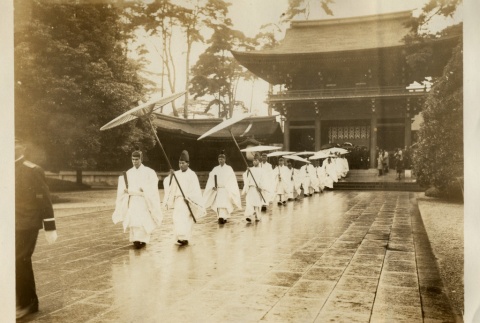 Shinto priests walking out of a shrine (ddr-njpa-8-41)