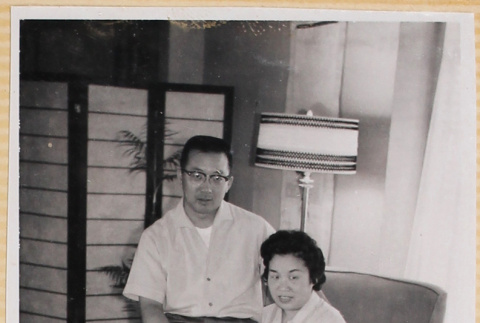 Couple sitting on chair (ddr-densho-522-64)