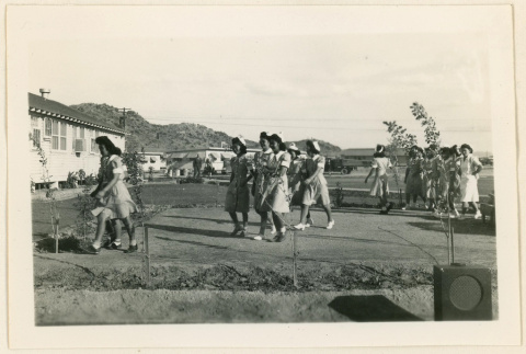 Dietitian aids walking to a hospital tea party (ddr-densho-37-1258)