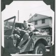 Man sitting in jeep (ddr-ajah-2-175)