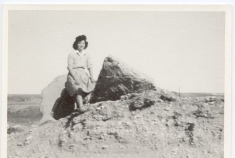 Girl posing on rock (ddr-hmwf-1-16)