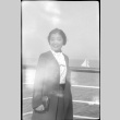 Woman on ship, sailboat in background (ddr-densho-426-1468)
