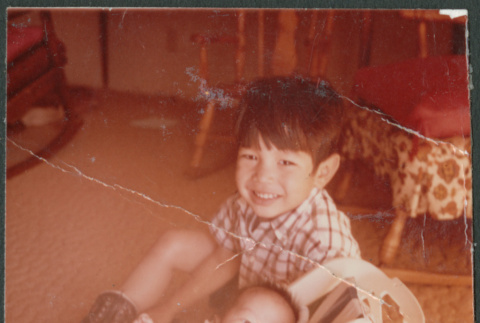 Danny Sakura with baby Peter Todd (ddr-densho-523-479)