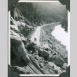 Men on road by large landslide (ddr-ajah-2-367)