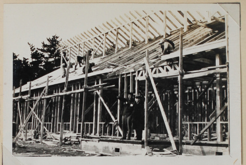 Construction on roof of a building (ddr-densho-433-695)