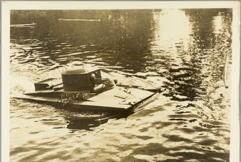 An amphibious tank surfacing in a river (ddr-njpa-13-439)