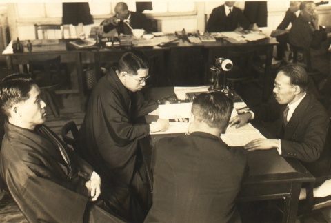 Men meeting with a lawyer to resolve a patent dispute (ddr-njpa-4-421)
