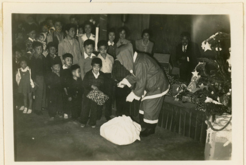 Santa Claus hands out gifts (ddr-densho-37-1302)