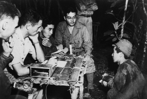 Jungle interrogation at table (ddr-densho-1007-439)