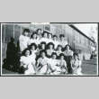 Photograph of Dagmar Quarnstrom and the hospital staff aides in front of the Manzanar hospital (ddr-csujad-47-193)