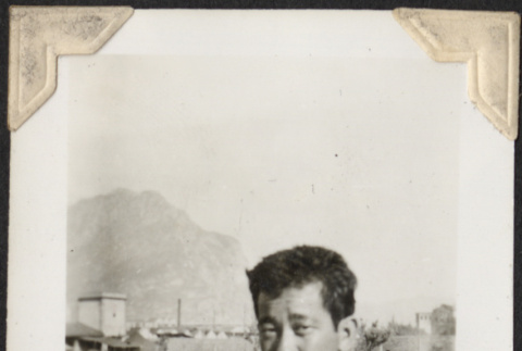 Man with tents in background (ddr-densho-466-712)