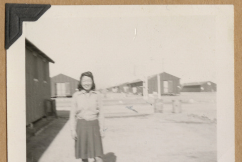 Young woman outside barracks (ddr-densho-542-239)
