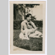 woman and dog in yard (ddr-densho-378-169)