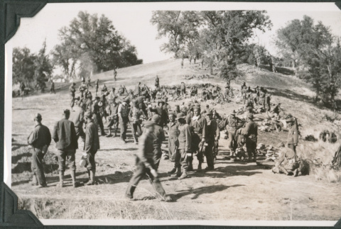 Group of men waiting in line (ddr-ajah-2-186)