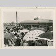 Men wave from a bus (ddr-densho-37-1438)