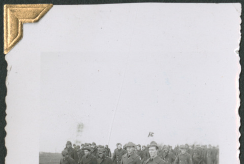 Men in overcoats walking in field (ddr-densho-434-91)