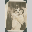 Iku Takahashi holding baby (ddr-densho-355-342)