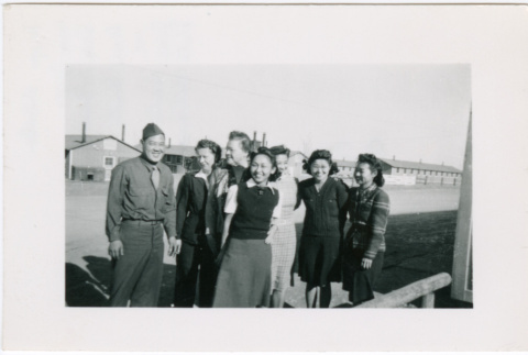 Group of five women and two men outside barracks (ddr-densho-356-1079)