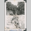 Woman and baby sitting on stone steps (ddr-densho-483-634)