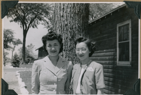 Two women pose outside (ddr-densho-397-61)