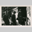 Tomoye Takahashi with unknown man and woman outside building (ddr-densho-426-1109)
