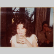 Woman with drink, man sitting in background (ddr-densho-426-1316)