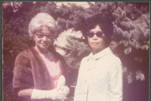 Agnes Sakura and another woman standing on lawn (ddr-densho-523-576)