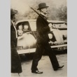 Neville Chamberlain walking with an umbrella (ddr-njpa-1-17)