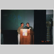 Scott Oki and Tom Ikeda at podium at JACC Meeting (ddr-densho-506-113)