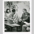 Staff Sergeant Dennis McGuire delivering letter and will of Japanese soldier Wataru Tanaka to his sister, Yoshikatsu Manabe (ddr-densho-1007-116)