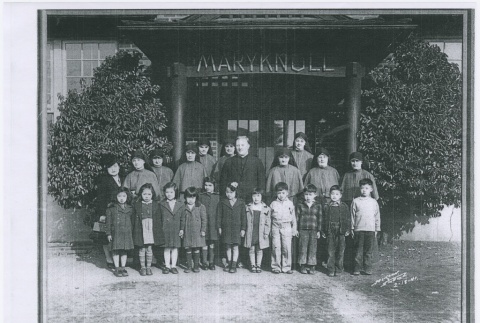 Priest with Nuns and children outside Maryknoll (ddr-densho-330-238)