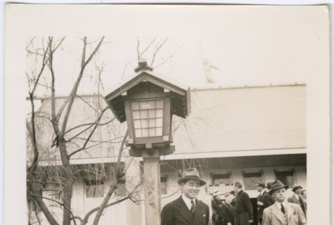 Man standing by lantern (ddr-densho-377-1644)