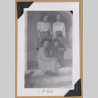 Women with two children on a porch (ddr-densho-542-312)