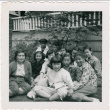 Group of adults and children sitting on lawn outside house (ddr-densho-430-298)