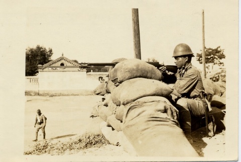 A soldier aiming a rifle (ddr-njpa-6-78)