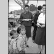 Two women with two small children on street (ddr-densho-426-2395)