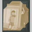 Child outside store (ddr-densho-442-213)