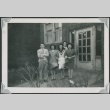 A group of friends in front of a building (ddr-densho-298-146)