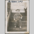 Toddler sitting on a stoop (ddr-densho-483-700)