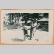 Photo of man standing by chair (ddr-densho-341-183)