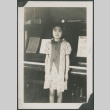 Young girl by piano (ddr-densho-355-425)